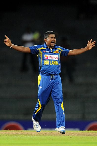 Sri Lankan cricketer Rangana Herath celebrates the wicket of South African batsman Alviro Petersen during the second One Day International (ODI) cricket match between Sri Lanka and South Africa at the R. Premadasa Stadium in Colombo on July 23, 2013. (Getty Images)